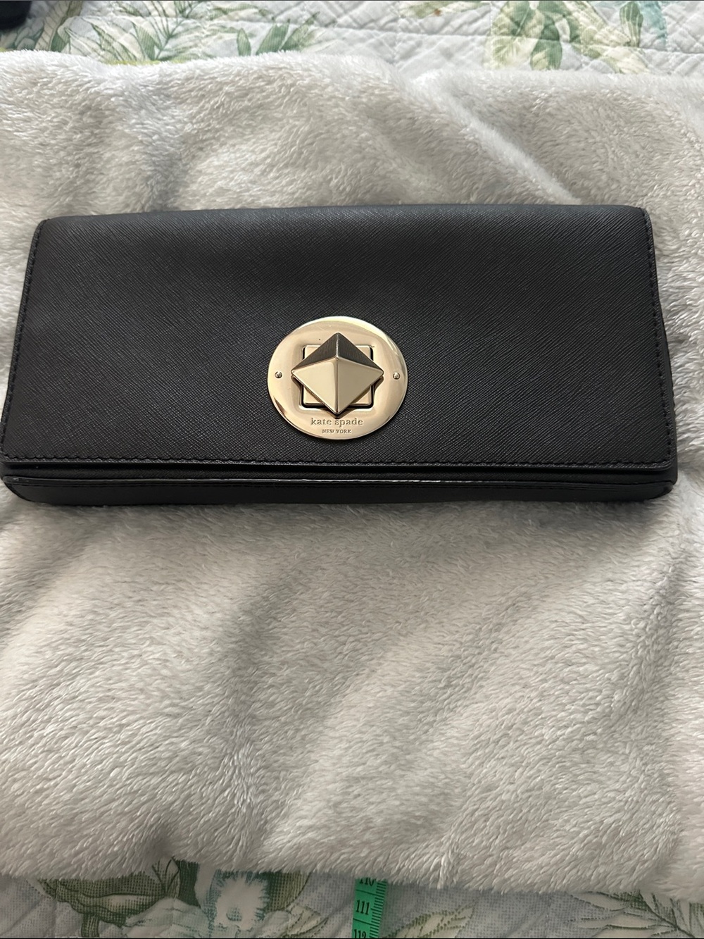 kate spade black clutch wallet with silver tone emblem